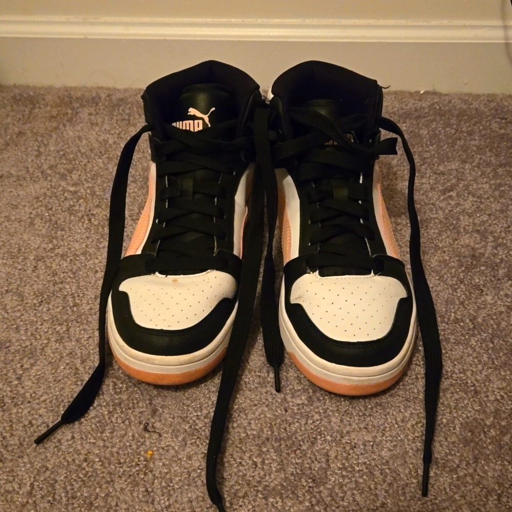 Pink and black, high-top Pumas